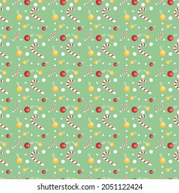 Christmas seamless pattern with flat design with lollipop, bell and dots on green background.