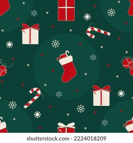 Christmas seamless pattern with gift boxes, candy cane, bell and xmas stocking in flat design