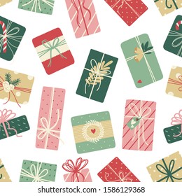 Christmas seamless pattern with gifts. Vector background on white. Cute illustration for fabric, wrapping paper, postcard design.