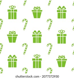 Christmas seamless pattern. Green colored candy canes and gift boxes on white background. Christmas texture