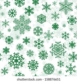 Christmas seamless pattern from green snowflakes on white background