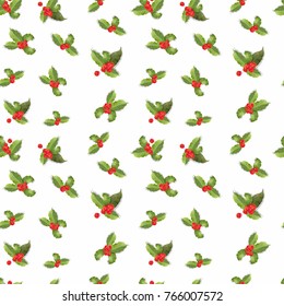 Christmas seamless pattern with holly leaves and berries.Xmas background of mistletoe.Holiday winter themed, flower and berries. Seamless pattern. Holiday greeting card.