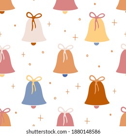 Christmas seamless pattern with jingle bells. Hand drawn vector pattern with bells for decorative design. Wallpaper, wrapping paper and textile. Vector background