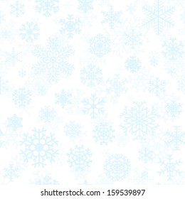 Christmas seamless pattern from light blue snowflakes on white background