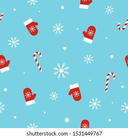 Christmas seamless pattern with mittens, candy canes, snowflakes and snowballs on blue background. Unique hand drawn winter design for greeting card, wrapping paper, fabric. Vector illustration.