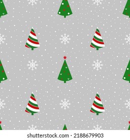 christmas seamless pattern on a gray background green fir trees and white snowflakes
