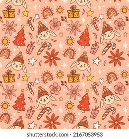 Christmas seamless pattern on pink background. Cute rabbits and boho elements. Merry Christmas and Happy New Year - Year of the Rabbit 2023.