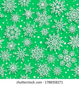 Patrón ininterrumpido de Navidad de copos de nieve de papel con sombras suaves sobre fondo verde