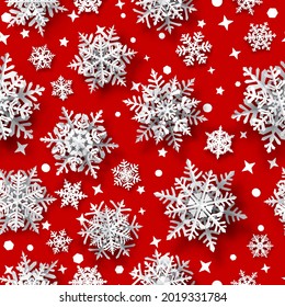 Christmas seamless pattern of paper snowflakes with soft shadows, white on red background