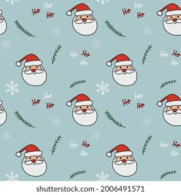 Christmas  seamless pattern with pine twigs,  Santa Claus face and christmas decoration.  Beautiful background for gift wrapping papers, greeting cards, decoration.