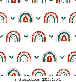 Christmas seamless pattern with rainbows and holly berry leaves. Cute winter background in boho style. Vector childish illustration for posters, textile, fabric, wrapping paper.