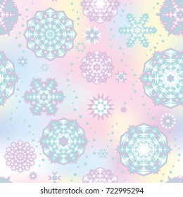 Christmas seamless pattern with random scatter falling snowflakes on a turquoise background.