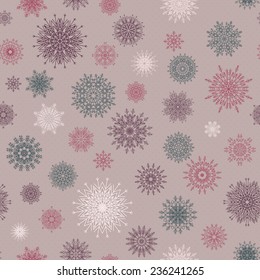 Christmas seamless pattern from red and blue snowflakes on a pastel background. Winter design background. Vector illustration.  Christmas template.