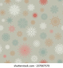 Christmas seamless pattern from red and blue snowflakes on a pastel background. Winter design background. Vector illustration.  Christmas template.