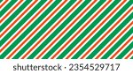 Christmas seamless pattern. Red and green diagonal stripes background. Candy cane repeating decoration wallpaper. Winter holiday lines backdrop. Xmas peppermint present wrapping print design. Vector