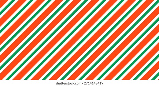 Christmas seamless pattern. Red and green diagonal stripes background. Candy cane repeating decoration wallpaper. Winter holiday lines backdrop. Xmas peppermint present wrapping print design. Vector