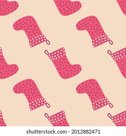 Christmas seamless pattern with red Christmas socks with snowflakes, specks, pattern