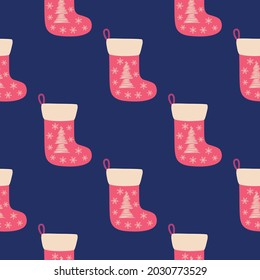 Christmas seamless pattern with red christmas socks with hand drawn christmas tree.