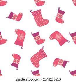 Christmas seamless pattern with red Christmas socks with snowflakes, specks