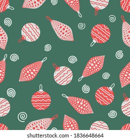 christmas seamless pattern with red and white christmas decorations on green background