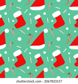 Christmas seamless pattern, santa hat, socks and candy stick, red color on green background.