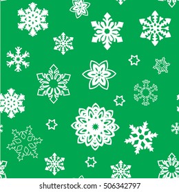 Christmas seamless pattern of small big snowflakes, white on green