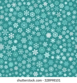 Christmas seamless pattern of small snowflakes, white and light blue on turquoise