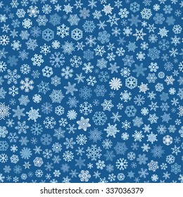 Christmas seamless pattern of small snowflakes, white on blue