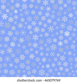 Christmas seamless pattern of small snowflakes, white on light blue