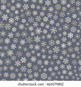 Christmas seamless pattern of small snowflakes, white on gray