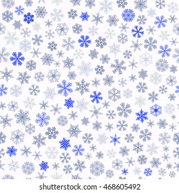 Christmas seamless pattern of small snowflakes, blue and gray on white