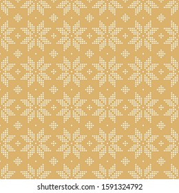 Christmas seamless pattern of snowflakes big classic knitted pattern of small circles of white dots on a golden beige background.