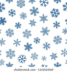 Christmas seamless pattern of snowflakes, blue on white background