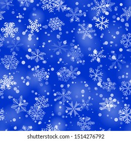 Christmas seamless pattern of snowflakes of different shapes, sizes and transparency in blue colors