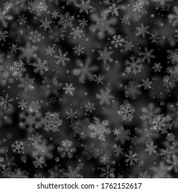 Patrón ininterrumpido de Navidad de copos de nieve de diferentes formas, tamaños, borrosidad y transparencia en el fondo negro