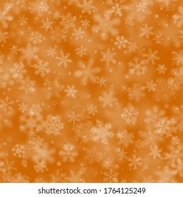 Christmas seamless pattern of snowflakes of different shapes, sizes, blur and transparency on orange background