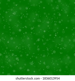 Patrón ininterrumpido de Navidad de copos de nieve de diferentes formas, tamaños y transparencia, sobre fondo verde