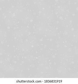 Patrón ininterrumpido de Navidad de copos de nieve de diferentes formas, tamaños y transparencia, sobre fondo gris