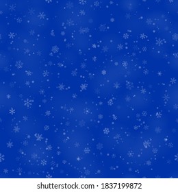 Patrón ininterrumpido de Navidad de copos de nieve de diferentes formas, tamaños y transparencia, sobre fondo azul