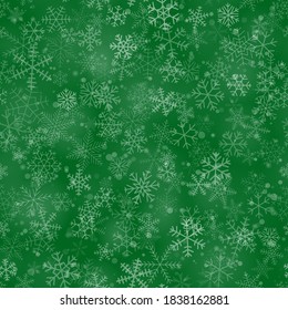 Christmas seamless pattern of snowflakes of different shapes, sizes and transparency, on green background