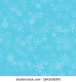 Patrón ininterrumpido de Navidad de copos de nieve de diferentes formas, tamaños y transparencia, sobre fondo azul claro