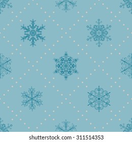 Christmas seamless pattern of snowflakes and dots, in light blue colors