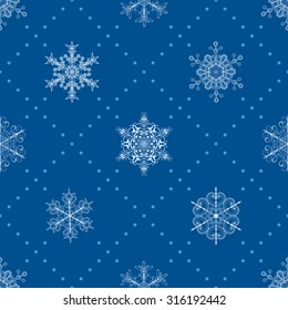 Christmas seamless pattern of snowflakes and dots, in blue colors