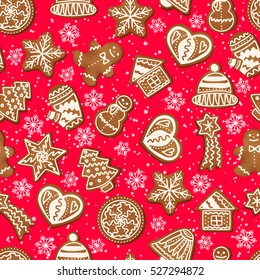 Christmas seamless pattern of snowflakes and gingerbread cookies.