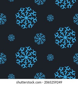 Christmas seamless pattern with snowflakes isolated on dark background. Happy new year wallpaper and wrapper for seasonal design, textile, decoration, greeting card. Hand drawn prints and doodle.