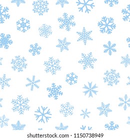 Christmas seamless pattern of snowflakes, light blue on white background
