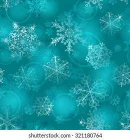 Christmas seamless pattern of snowflakes in light blue colors