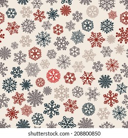 Christmas seamless pattern of snowflakes, multicolored on white