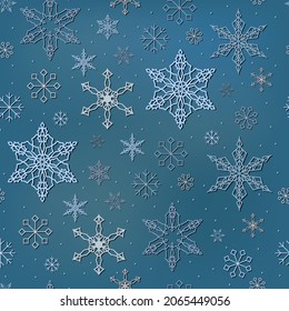 Christmas seamless pattern with snowflakes on a blue background.
