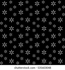 Christmas seamless pattern with snowflakes on black background. Winter background for various graphic works.